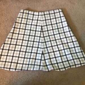 Knee Length white and black checkered skirt.